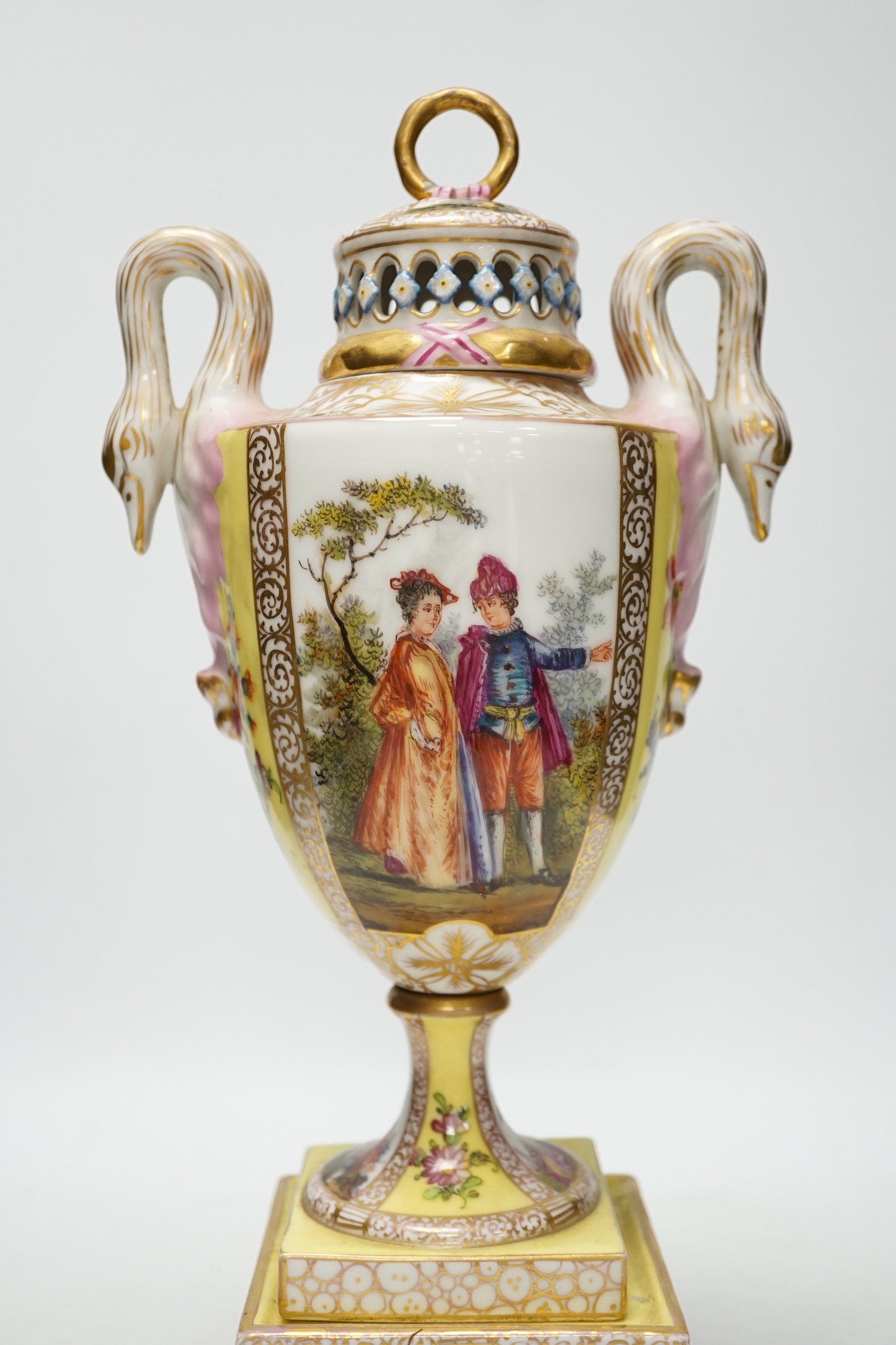 A Dresden yellow ground vase and cover with swan handles and figural cartouche, 36cm high